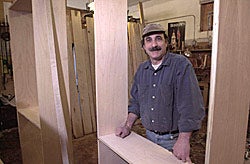 Using a little Old World craftsmanship, cabinetmaker Paul Gianino of Greenville is creating bookcases to house the Laupus Library's rare and historic collections. Photo by Cliff Hollis