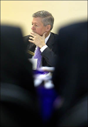 Chancellor Steve Ballard listens to presentations during the ECU Board of Trustees meeting.