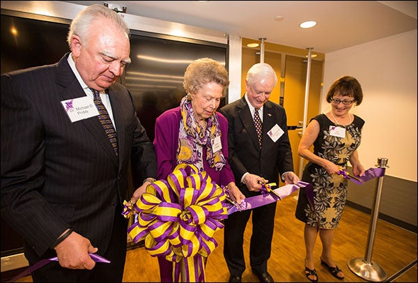 Cutting the ribbon for the Janice Hardison Faulkner Gallery are Michael Priddy, Faulkner, former state governor Jim Hunt and Jan Lewis, interim dean of Academic Library Services.