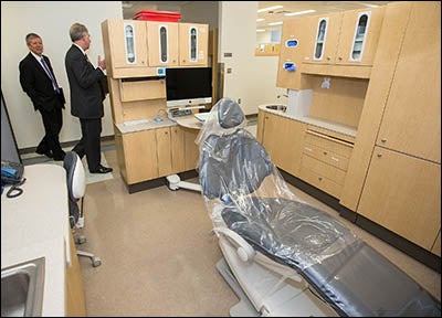 ECU Chancellor Steve Ballard, left, and Greg Chadwick, dean of the ECU School of Dental Medicine, tour the Lillington facilities on March 24, during a ribbon-cutting for the new community service learning center.