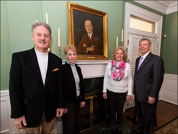 Unveiling a portrait of the man who built the Dail house, home of ECU chancellors since 1965, left to right, Alex B. Dail, Nancy Dail Hall, Anne Dail Ashe and Chancellor Steve Ballard. (Photos by Cliff Hollis)