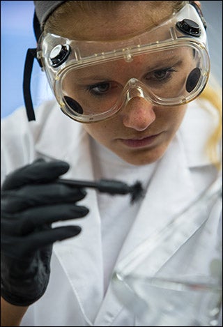 ECU student Margaret Whittemore performs an experiment in the forensic lab at ECU.