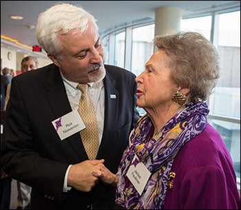 ECU vice chancellor Rick Niswander greets Janice Faulkner at the gallery opening held in her honor.