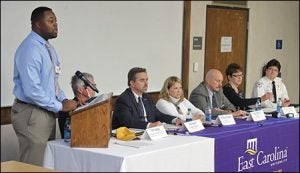 Moderator Truman Vereen, left, leads the panel discussion on Ebola preparations at ECU during the panel discussion held Nov. 17. Vereen is president of the ECU Public Health Organization.