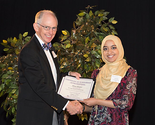 Physician Assistant Studies student Hina Khatri receives the Dr. Dale Newton Scholarship from its namesake, Dr. Dale Newton, an ECU professor and medical director of the PA Studies program. (Photos by Gretchen Baugh)