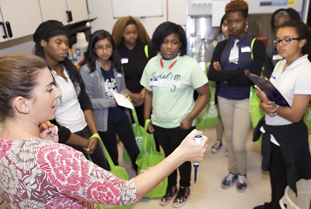 Dr. Lisandra de Castro Bras, assistant professor in the Department of Physiology, demonstrates a tool for students.