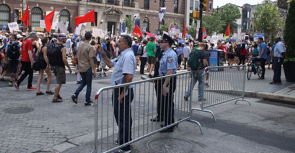 Police block a street in Philadelphia during a protest march.