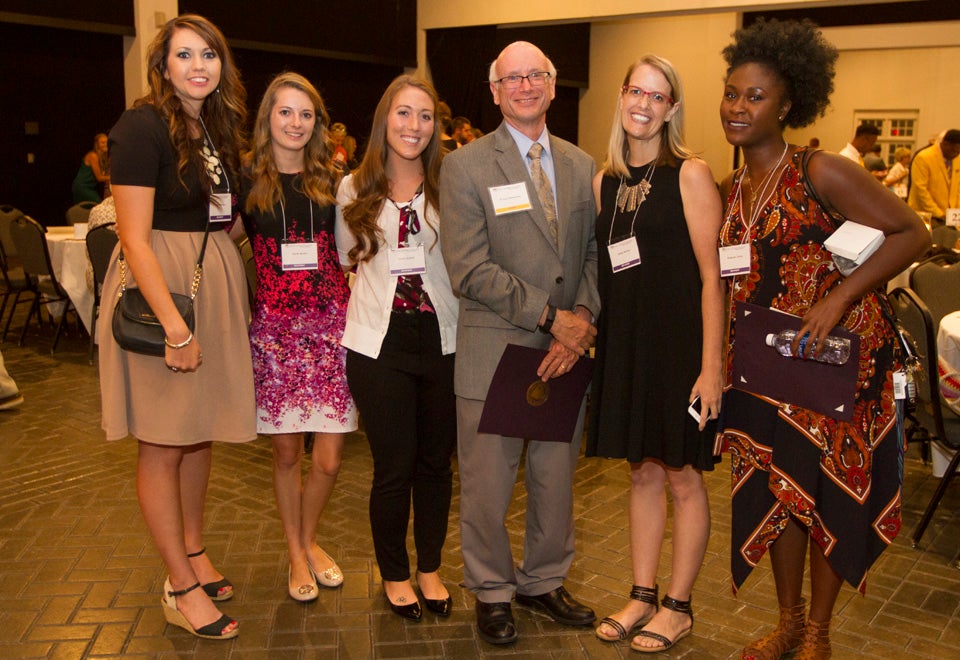 At center, Dr. Paul Gemperline, dean of the ECU Graduate School, stands with graduate students (left to right) Lauren Master, Sarah Burke, Paula Howell, Idella Wilson and Matesha Jones who received Master in Teacher (MAT) Tuition grants-in-aid. The scholarships are awarded to students who show outstanding promise for significant contributions to the field of education. The funds support MAT students during their full-time internship semester and are funded by the ECU Graduate School.