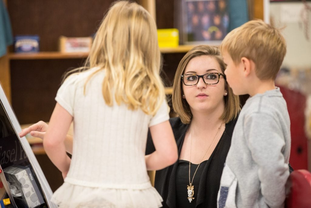 Amanda Blakley works with students at the Nancy Darden Child Development Center on campus. (Photo by Cliff Hollis)