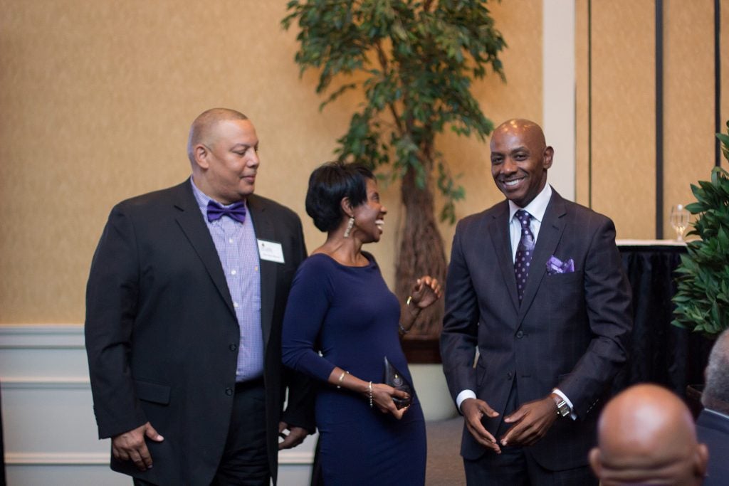 Dr. Virginia Hardy laughs after being surprised by receiving the Ledonia Wright Outstanding Faculty-Staff Award. With her is Sheridan Barnes, Black Alumni Chapter president, left, and Dr. Anthony Jackson, BAC president-elect.