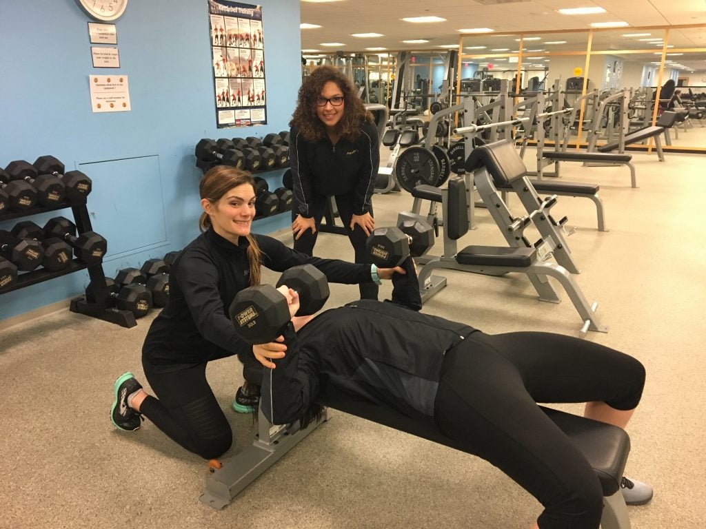 Kristin Carbonara ‘10 (left) and Kindal Smith ‘12 are health fitness specialists who once took classes together at ECU and now work together with Aquila in Washington, D.C. (Contributed photo)