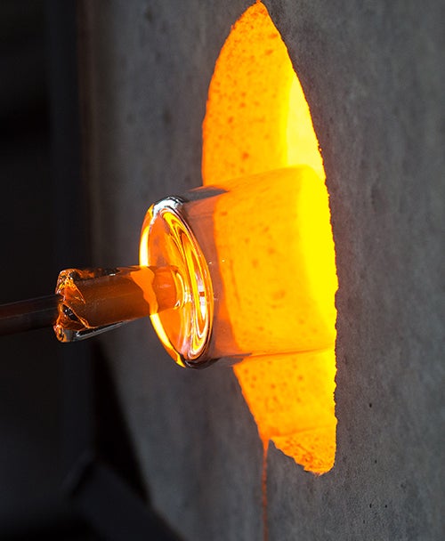 Glass is pushed in the electric furnace in the ‘GlasStation,’ the home of ECU’s first glassblowing class in Farmville." title="Glass is pushed in the electric furnace in the ‘GlasStation,’ the home of ECU’s first glassblowing class in Farmville.