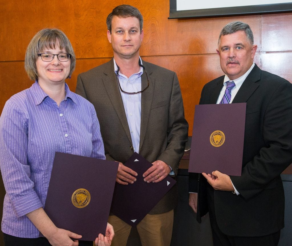  The Centennial Award in the category of leadership recipients are Dr. Wendy Sharer, John Gill and Ernest Marshburn, from left.