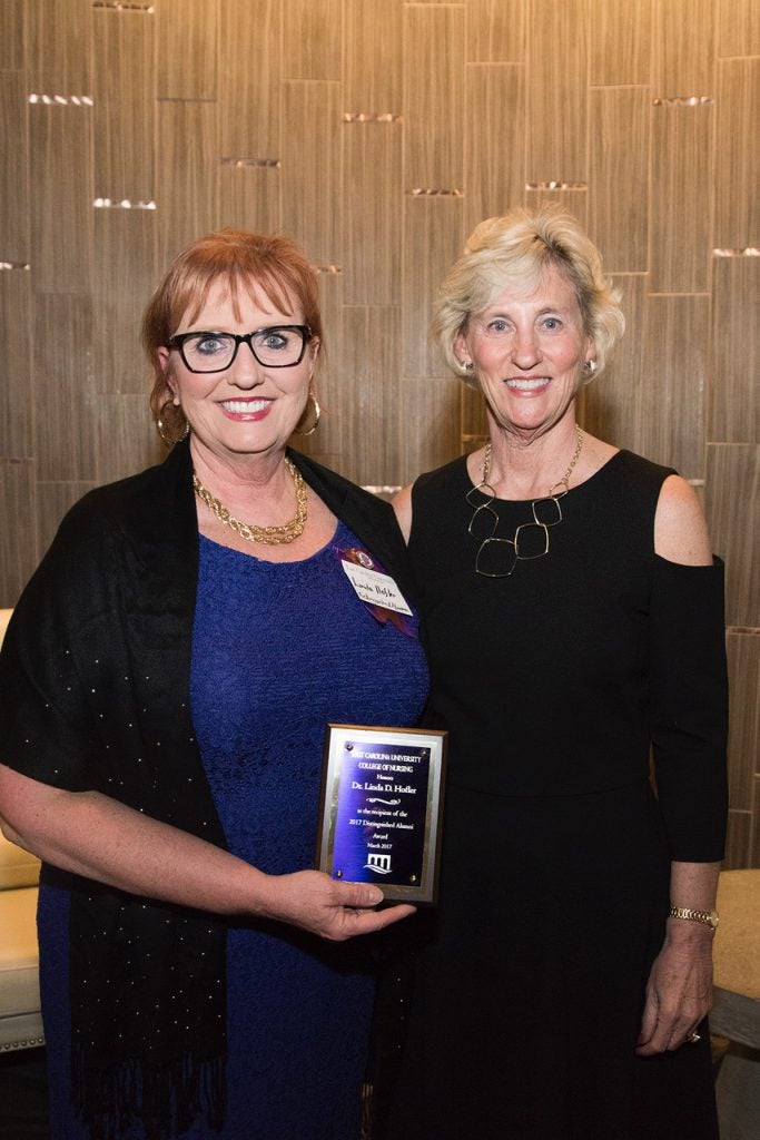 Distinguished Alumni Award recipient Linda Hofler, left, and College of Nursing Dean Sylvia Brown.