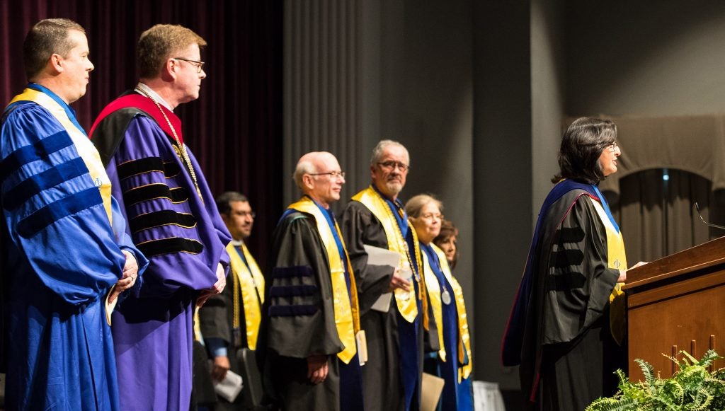 PKP President Marianna Walker introduces the processional. (Photos by Cliff Hollis)