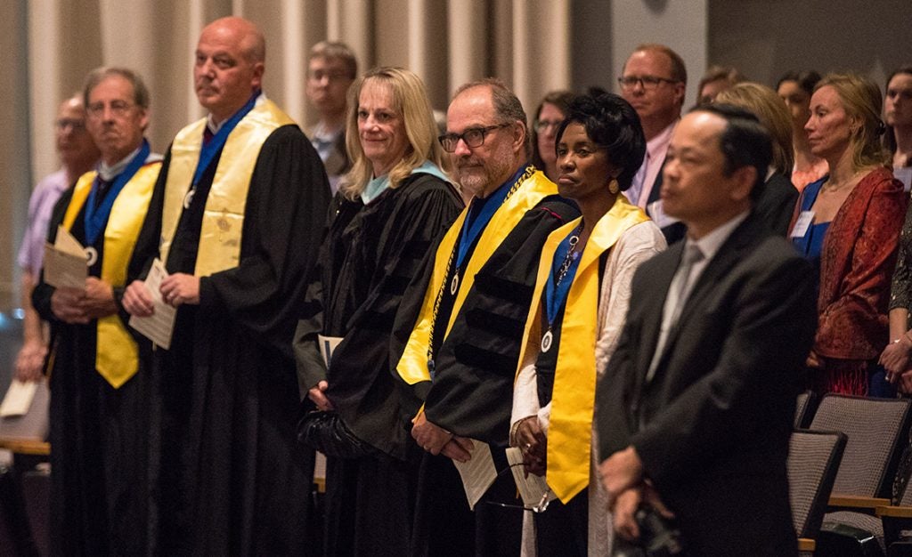 Fellow members of the ECU Phi Kappa Phi chapter watch as Chancellor Cecil Staton is inducted.