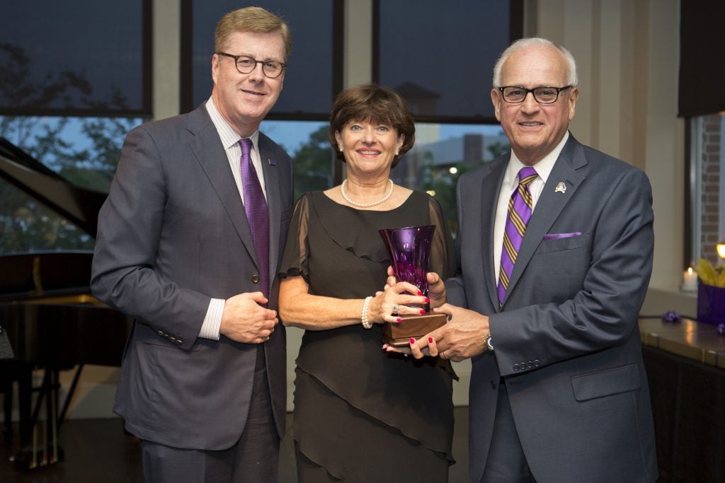 Connie and Carl (right) Rogers receive the Chancellor’s Amethyst from Chancellor Staton for their continued support and service to ECU. 