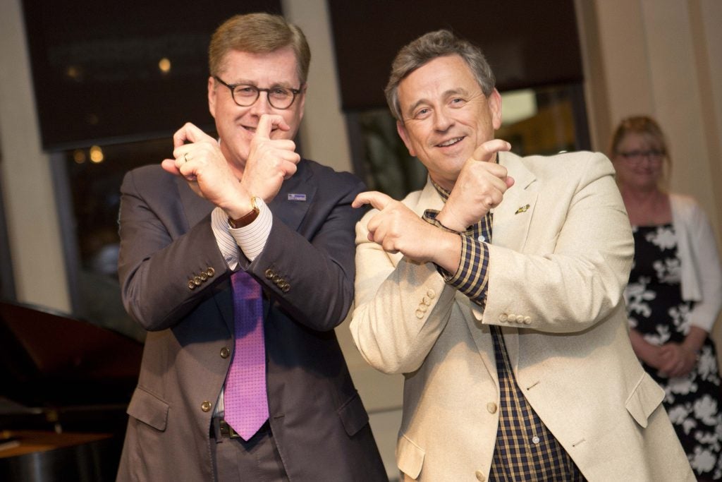 Outgoing ECU Board of Trustees member Terry Yeargan (right) and Chancellor Staton show off their Pirate Pride at Thursday night’s dinner.