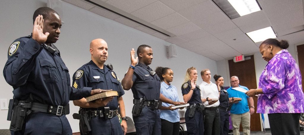 Four new ECU Police officers were sworn in alongside their family and friends on June 21. (Photos by Cliff Hollis) 