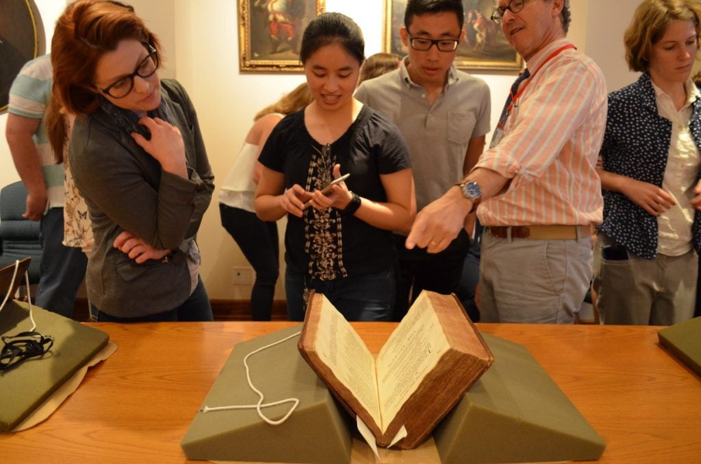 In "the Vault" looking at 400 + year old manuscripts.  This was a surreal, spiritual and elating experience! Left - Sarah McKeever looking at the book. (Photos by Syd Bauerman)