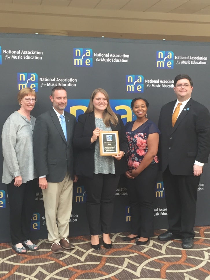 ECU music education student Lauren Lewis (center) accepts the 2017 Kane Scholarship and Collegiate Professional Achievement Award. Pictured with NC Music Educators Association officers. (contributed photo) 