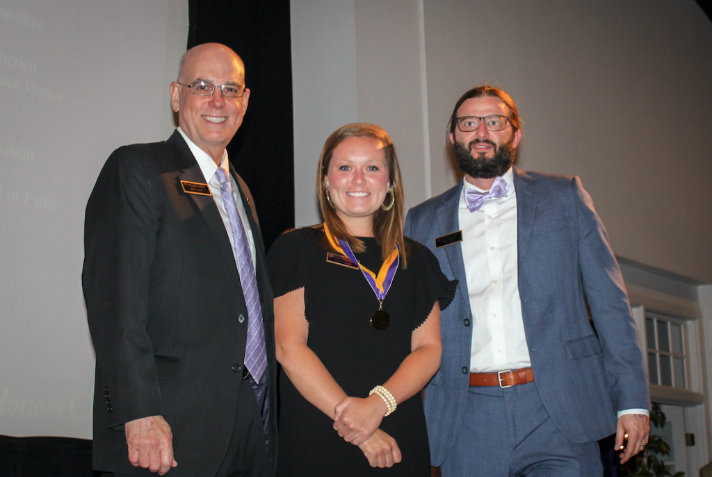  Left to right, Honors College Dean David White, Katie Stanley and EC Scholars director Todd Fraley celebrate during the Honors College graduation ceremony in May. Stanley has been named a NC Presidential Scholar at the UNC General Administration. (contributed photo) 