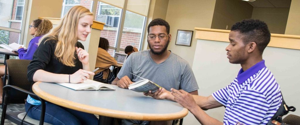 From left, students Sarah Marisa Mee, Daquevon Rogers and Kia Miller work together in Garrett Residence Hall. (contributed photos) 