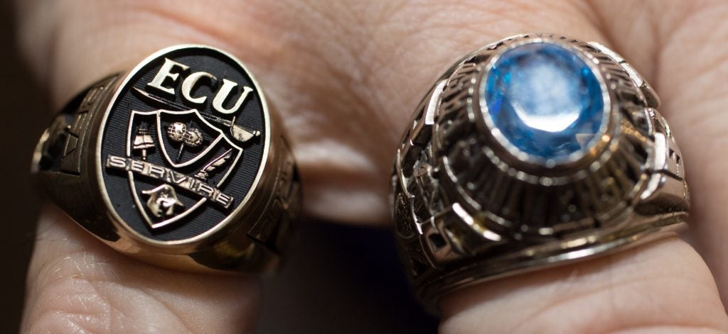 ECU Alumnus, Neil Dorsey, shows off his 1965 ECU class ring (right) compared to the new official signet ring. Dorsey was part of the ring committee that came up with the new designs. (Photos by Cliff Hollis)