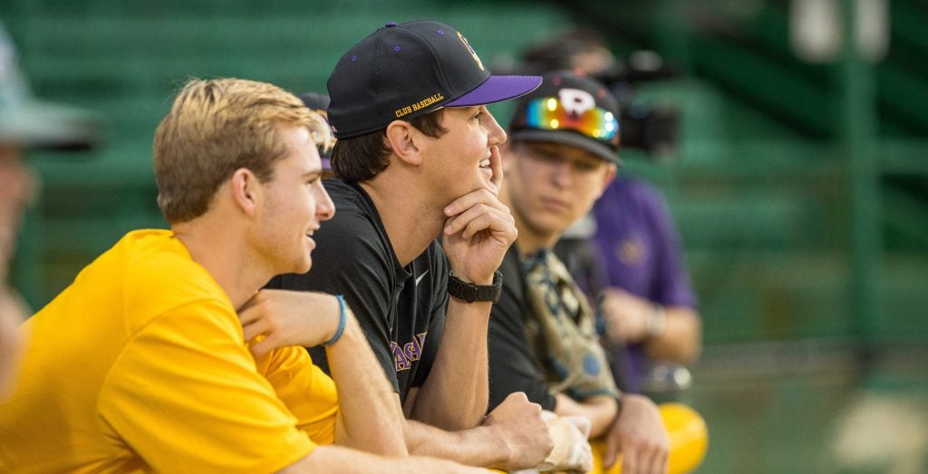 Duncan and his former teammates look on as the ECU Club Baseball team scrimmages. 