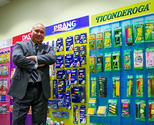 Gomez stands in front of several of Dixon Ticonderoga Company’s products.