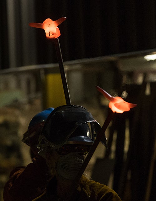 Students fly honeybees around the ECU sculpture yard in a nighttime performance of “Carolina Crosspollination.”