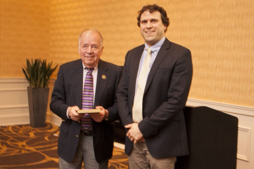 Dr. Jon Tingelstad is presented the 2017 Friend of the Year award by Dr. John Papalas, chair of the Friends of Laupus Library. (contributed photo)