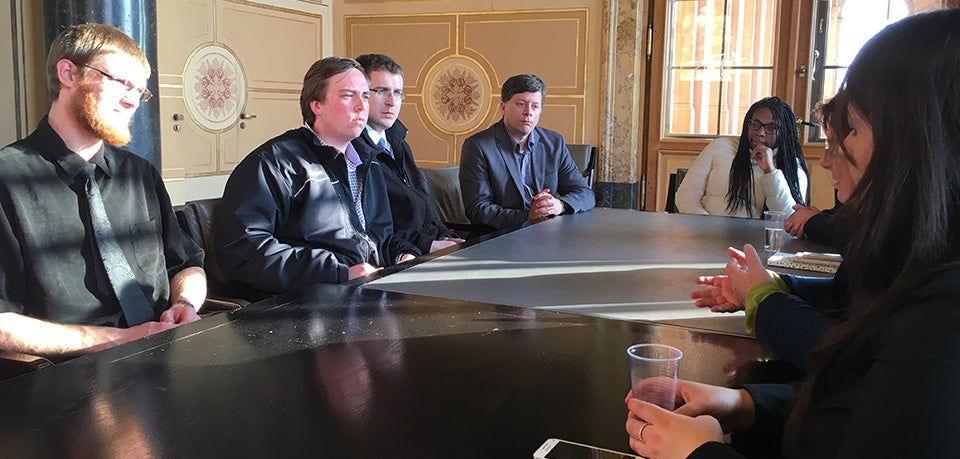 L to R: ECU students Jeffrey Mullins, Bennett Yeargan, Anthony Razov, Associate Professor David Smith and student Kestra James listen as Bavarian state parliament member Christine Kamm answers a question regarding Germany's response to the refugee crisis while Vaniessa Rashid, representative for integration in Perlach (Munich) and Kamm's assistant, looks on.