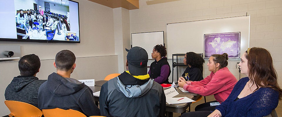 Below: Students at ECU participate in a video session with students in China.