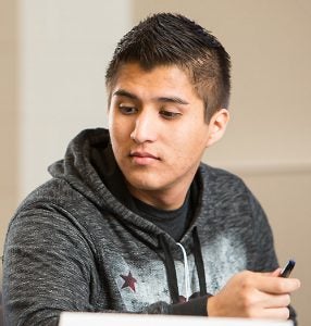 Student Andrew Ramirez participates in a video chat.