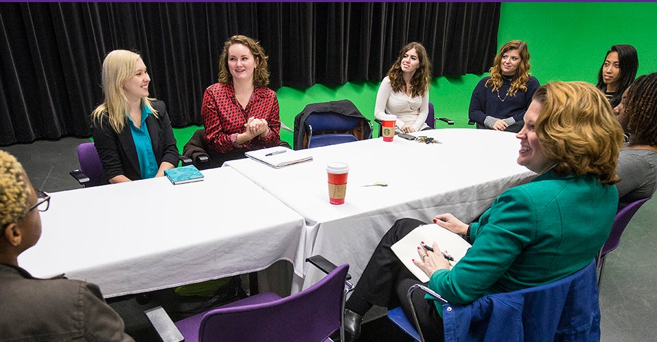 In December, ECU students met with Shannon Vickery, director of production at UNC-TV, to view a rough cut of “Love in War: The Blalock Story,” a true story about a North Carolina woman who, disguised as a man, joined the Confederate Army to be close to her husband during the Civil War. Pictured left to right are ECU students Maia Swan, McKenzie Shelton, Audra Entzi, Delaney Searles, Chanel Wang, Kiwii McLaurin and Kayah Oluronbi with Vickery (in the green jacket in foreground).