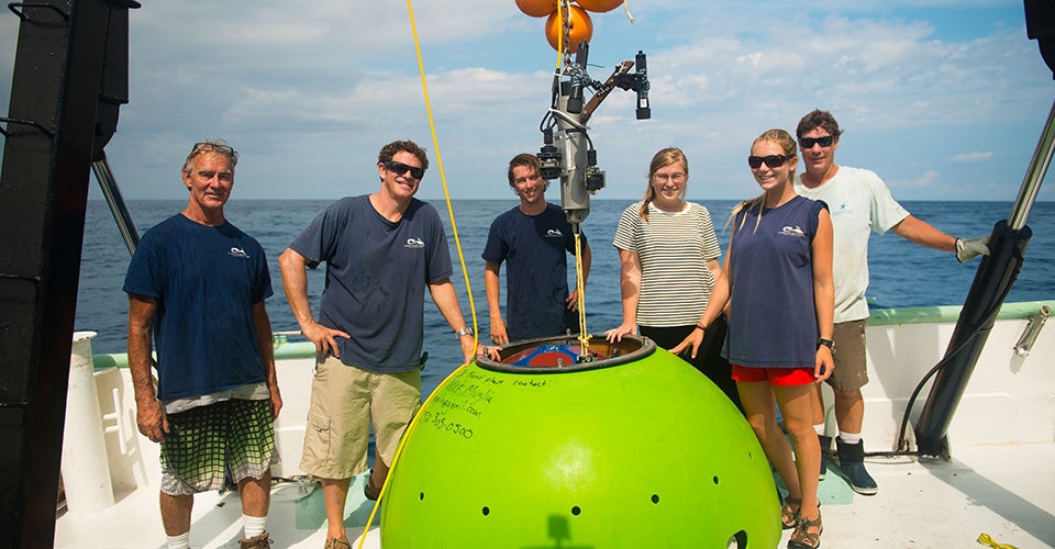 CSI researchers and technicians prepare to deploy a Doppler current profiler to track water flow in the Gulf Stream.