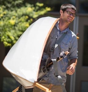 Instructor Judd Snapp walks out of Jenkins to the common.