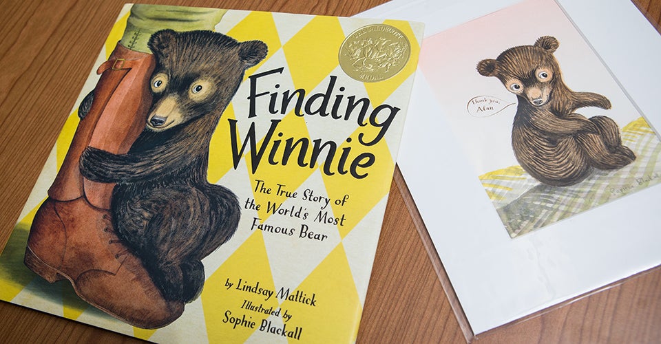 The Caldecott selection committee made the final decision about “Finding Winnie” at the American Library Association’s midwinter conference in Boston. Alan Bailey received personalized art featuring the book's main character (right).