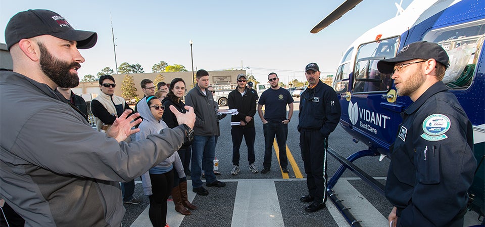 Brody School of Medicine students ask questions of Vidant Health’s EastCare transport paramedic Andrew Owens.