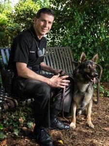 Officer T. Hammell poses with K-9 Marco. ECU Police were recognized for the unique challenges faced by campus law enforcement.