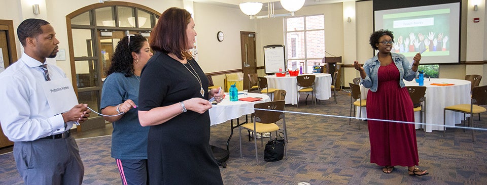 Health educators at the Family Life Institute participate in the class exercise, Tug of Values.