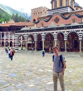 During a tour of Vitosha Mountain in Sofia, Bulgaria, ECU student Hunter Marshall takes in an amazing view of the Dragalevtsi Monastery in the background. (Contributed photo)