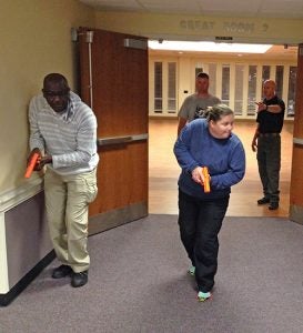 ECU Police officers go over hallway and room clearing techniques before they gear up with real guns for an active shooter simulation. (Contributed photo)