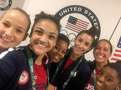 Athletic trainer for USA Gymnastics and ECU alumna Alicia Lysiuk ’02, second from right, got a selfie with “the final five.”