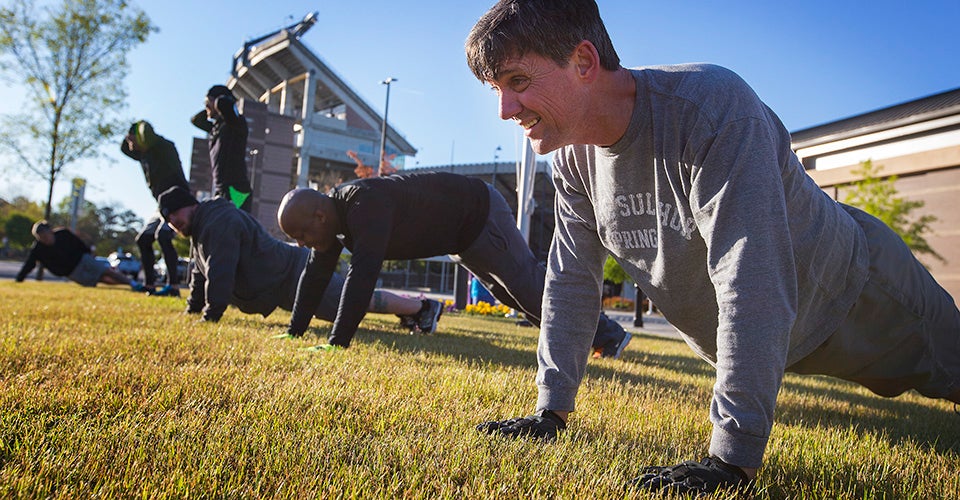 F3 members work out near Dowdy-Ficklen Stadium.