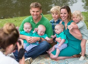 Lauren and Adam Faul of New Bern with their fraternal triplets Harrison, Rowan and Sutton, and siblings Macallan and Isla.