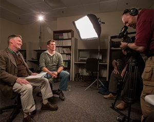 Dr. Mark Stebnicki prepares to conduct an interview with military veteran Ty Shaw for use in a distance education course in military and trauma counseling. (Photo by Cliff Hollis)