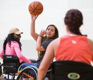 Students learn to play wheelchair basketball as part of Williams’ recreational therapy class.