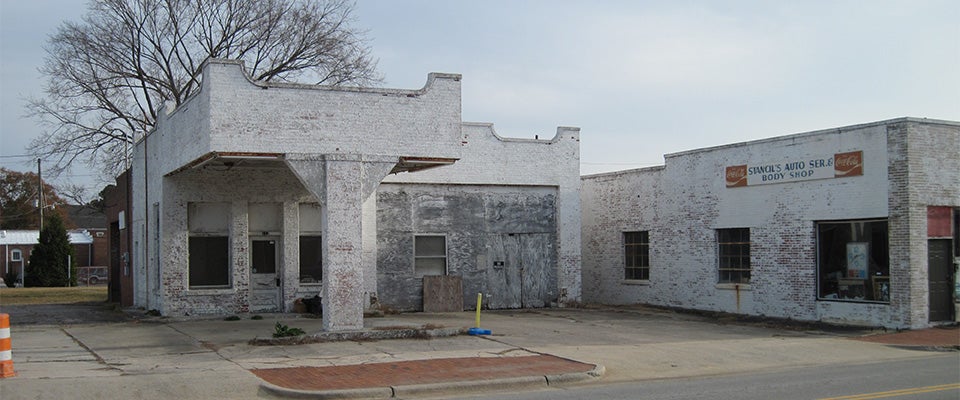 This photo was taken before the former gas station in downtown Farmville was renovated to house ECU’s hand-blown glass art studio. (Contributed photo)